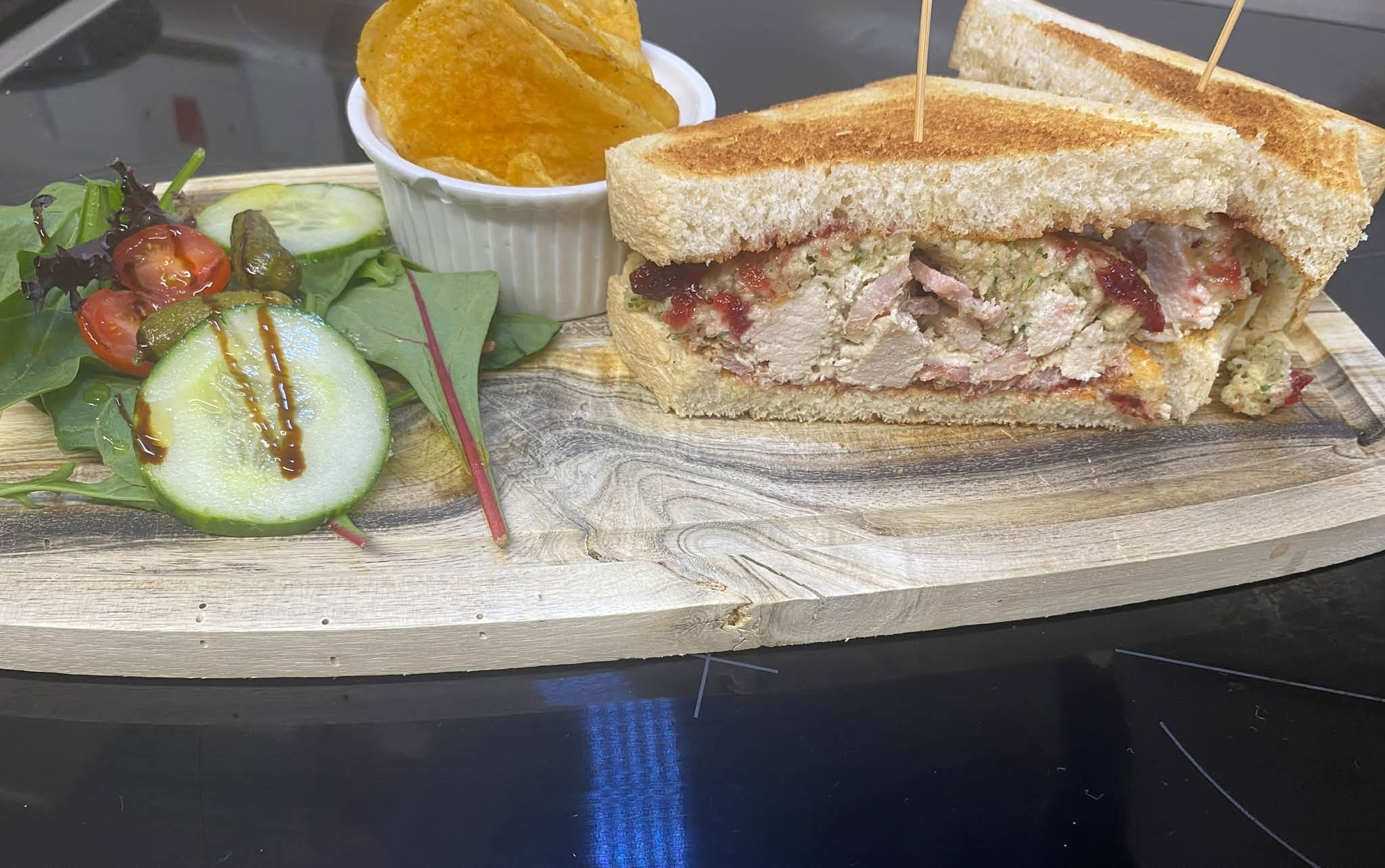 Interior of Emily Rose Tearoom with burgundy seating and wallpaper